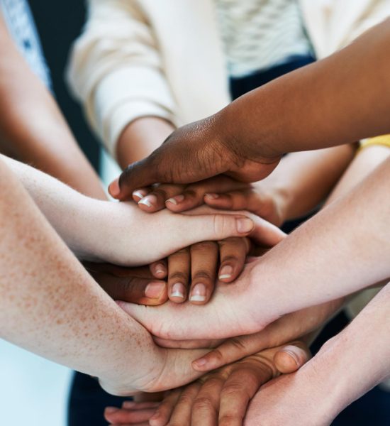 united-as-team-shot-group-people-putting-their-hands-together